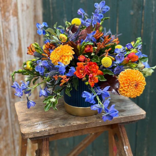 Colourful arranagement with dahlias and Delphinium